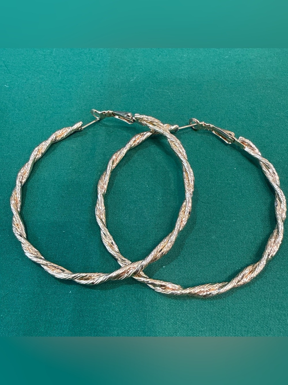 Large Goldtone Hoop Earrings Feature A Twisted Design. 14F